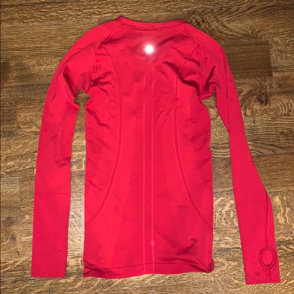 A red lululemon long sleeve shirt